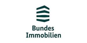 Bundes Immobilien logo: teal shield emblem above the bold text 'Bundes Immobilien'.